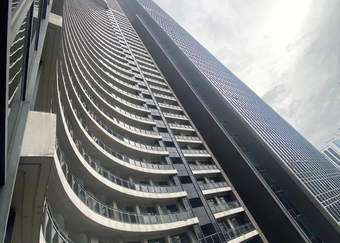 Apartment Spacious High Ceiling 2 Bedroom 66th Flr Corner Unit With Balconies - Free Sauna Pool Gym View Of Skyline Bay-sunset Manila